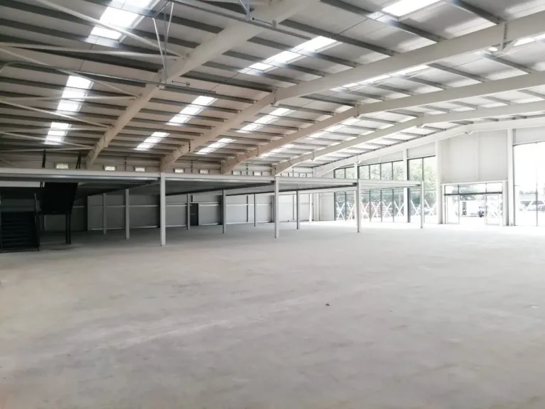 Mezzanine Flooring under construction inside a large commercial steel framed showroom building development