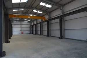 Interior of an industrial steel frame building with an internal crane system