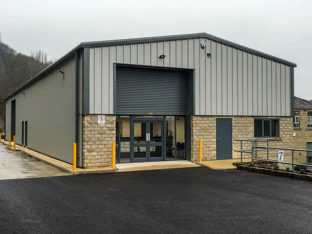 A High quality image of an Industrial Steel Framed Building designed, supplied and installed by Springfield Steel Buildings with insulated cladding and bespoke steel frame. SSB also provided the groundworks for the structure.