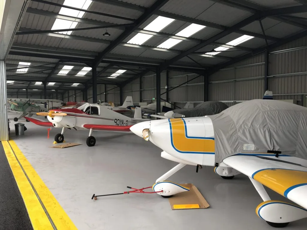 Aircraft inside a large hangar